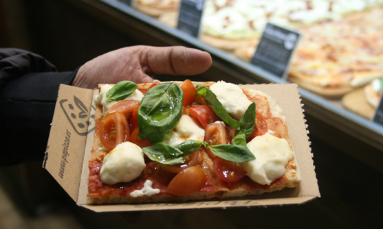 Porción de pizza al corte de Papizza